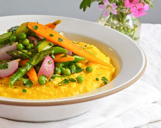 A delicious serving of polenta with spring vegetable ragout. Photo Credit: thekitchn.com