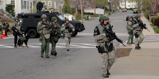 The police blocked off a 20-block residential area and urged residents to stay indoors. Photo Credit: NY Times