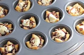 These delectable bites perfectly combine the sweetness of brown sugar and the savory richness of brie cheese./Photo credit: ezrapoundcake.com