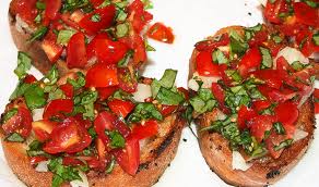 Bruschetta is an easy holiday appetizer, when topped with tomatoes and basil is the perfect vegan treat./Photo credit: savoring today.com