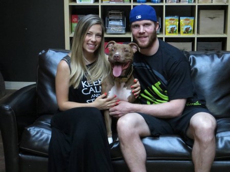 Chicago Blackhawks, Bryan Bickell, poses with his wife and pit bull.