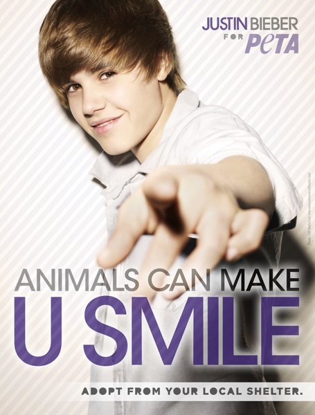 Justin Bieber Adopt Ad: Justin Bieber stars in an ad for PETA featuring the tagline, "Animals Can Make U Smile. Adopt From Your Local Shelter." Photo Credit: PETA